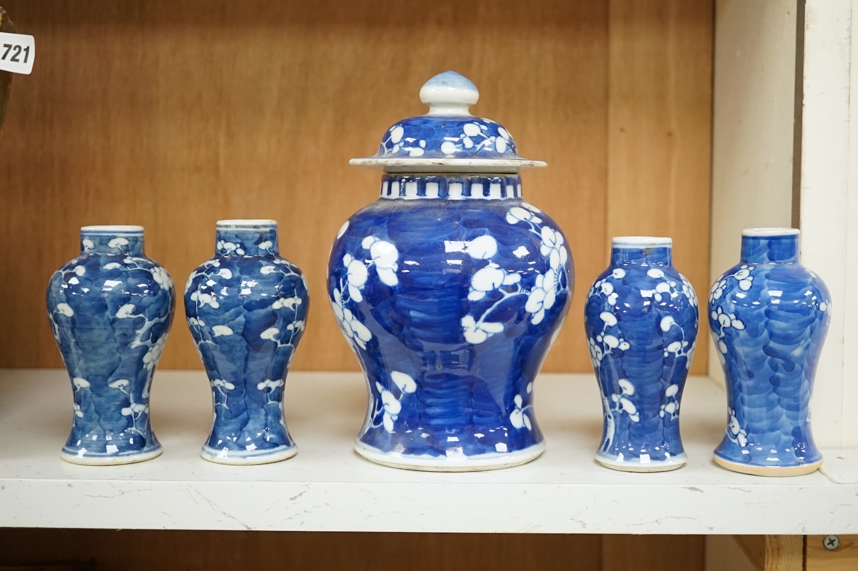 A group of five Chinese blue and white prunus vases, one with cover, late 19th century, tallest 20cm. Condition - varies